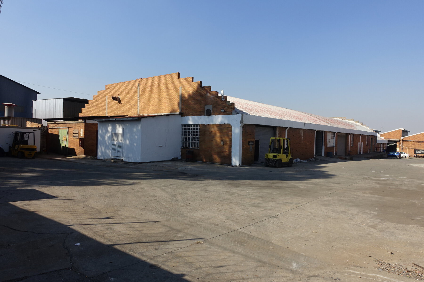 Large industrial warehouse with brick and metal construction in Elandsfontein, suitable for manufacturing or storage, with ample parking space.
