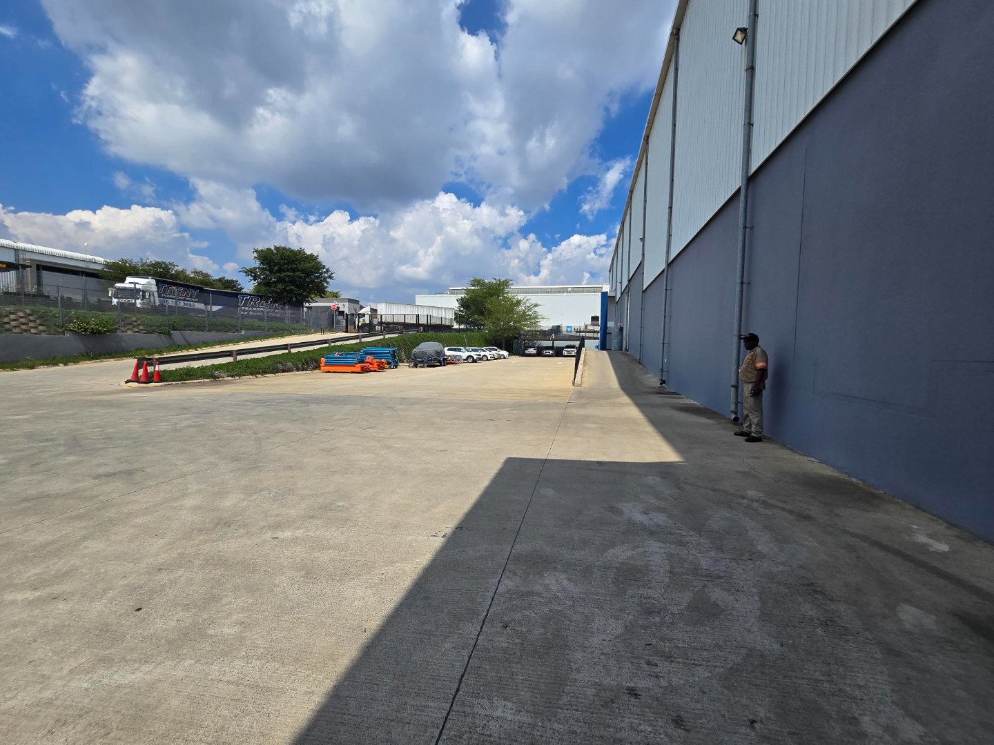 Spacious industrial premises with large warehouse and parking area in Meadowview, ideal for manufacturing or storage, with clear skies and modern facilities.
