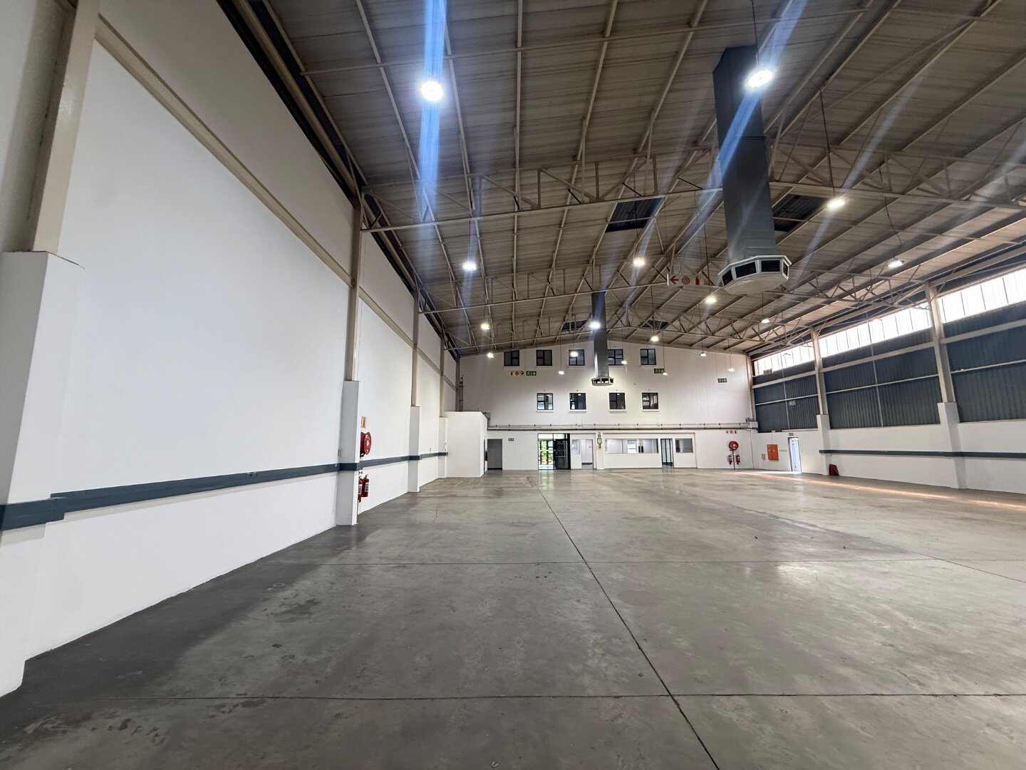 Modern Warehouse Space in Bryanston Spacious modern warehouse with high ceilings, industrial lighting, and ventilation systems in Bryanston, suitable for logistics and storage.