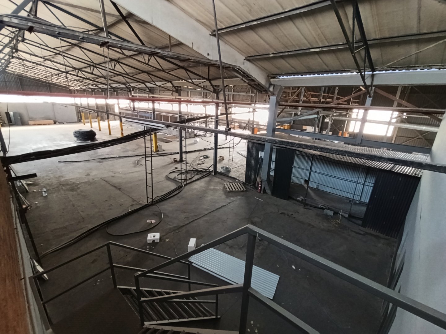 Industrial Warehouse Construction Site Construction site of an industrial warehouse with steel framework and roofing in Alrode, showcasing ongoing building development.