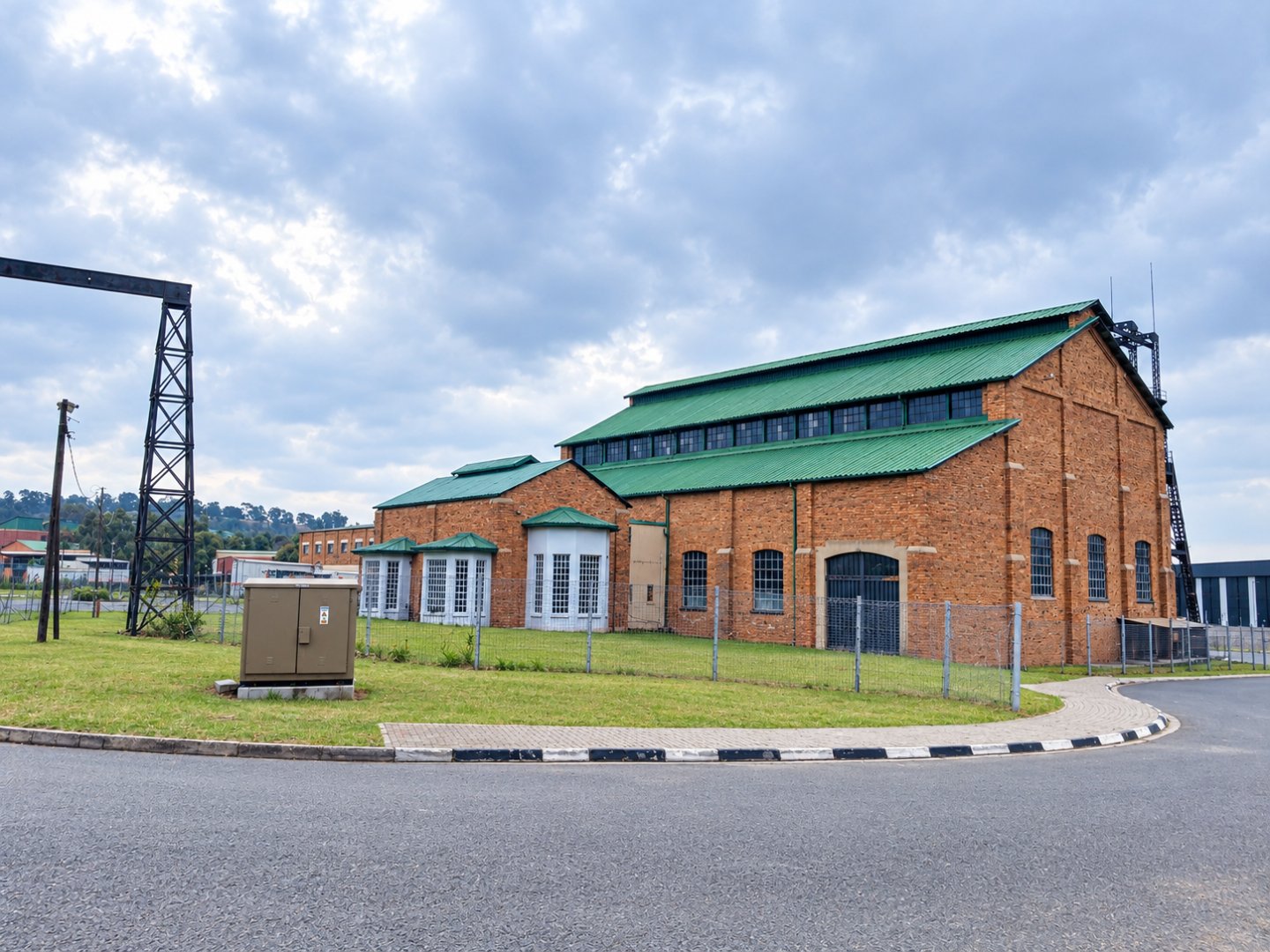 Currie Group Offices and Warehouses Modern brick office and warehouse building with green roof, part of Currie Group's facilities since 1887, located in an industrial area.