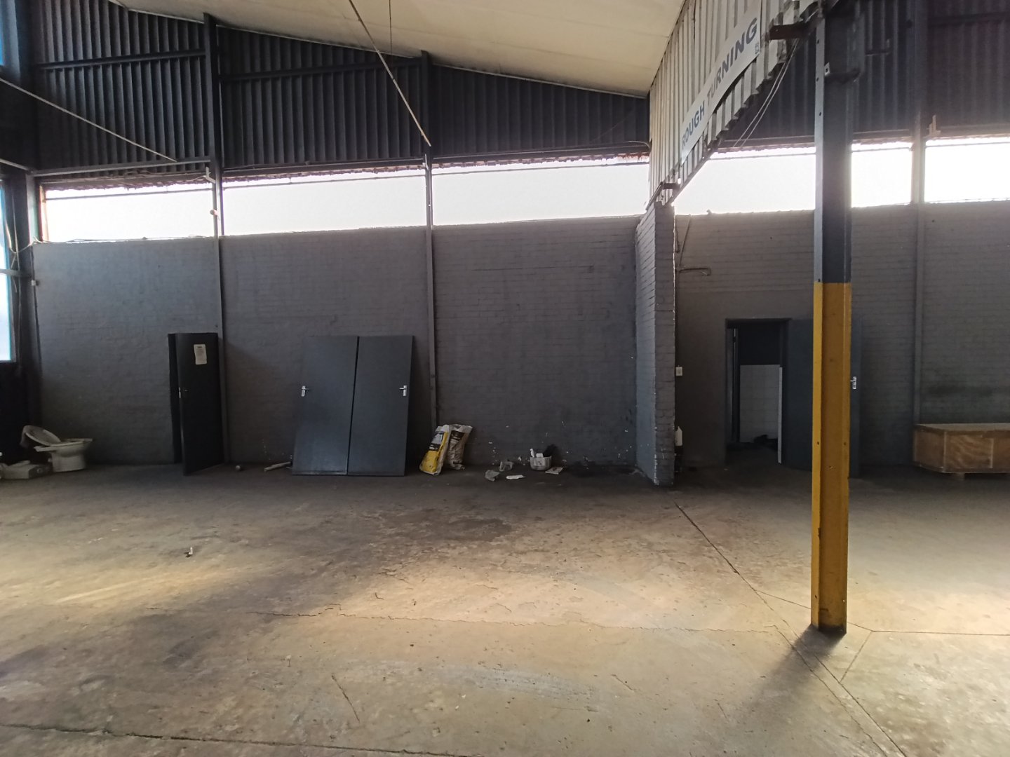 Industrial Warehouse Interior in Alrode Spacious industrial warehouse in Alrode with high ceilings, concrete floors, and minimal interior fixtures, suitable for storage and logistics operations.