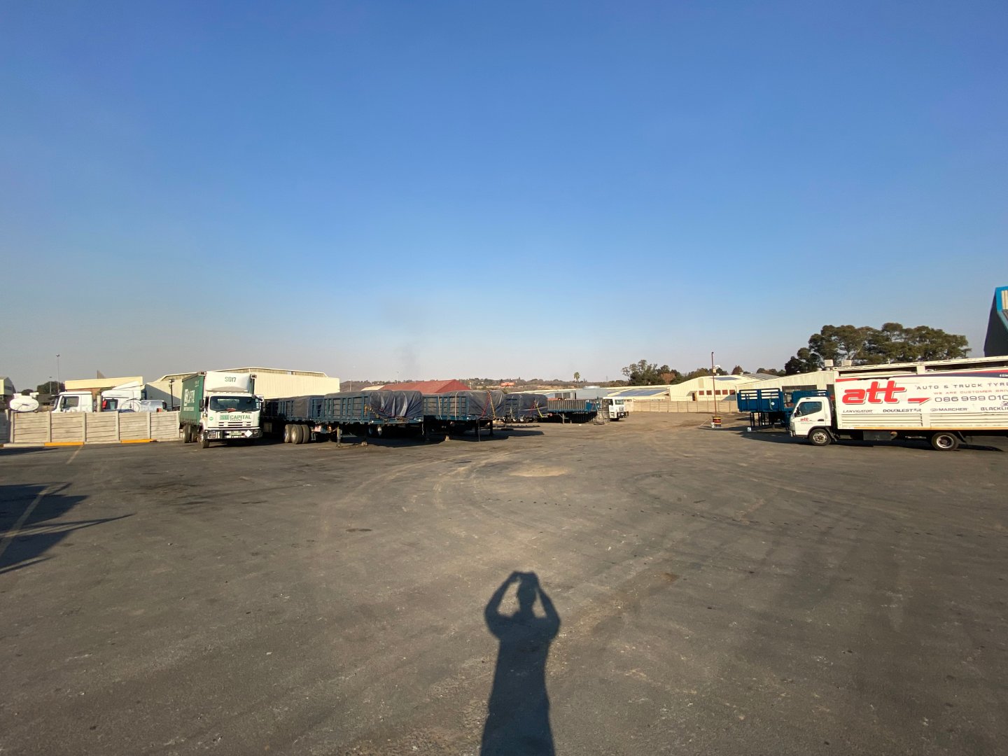 Large industrial property with trucks and warehouses in Alberton North, available for sale, featuring open space and logistics facilities.