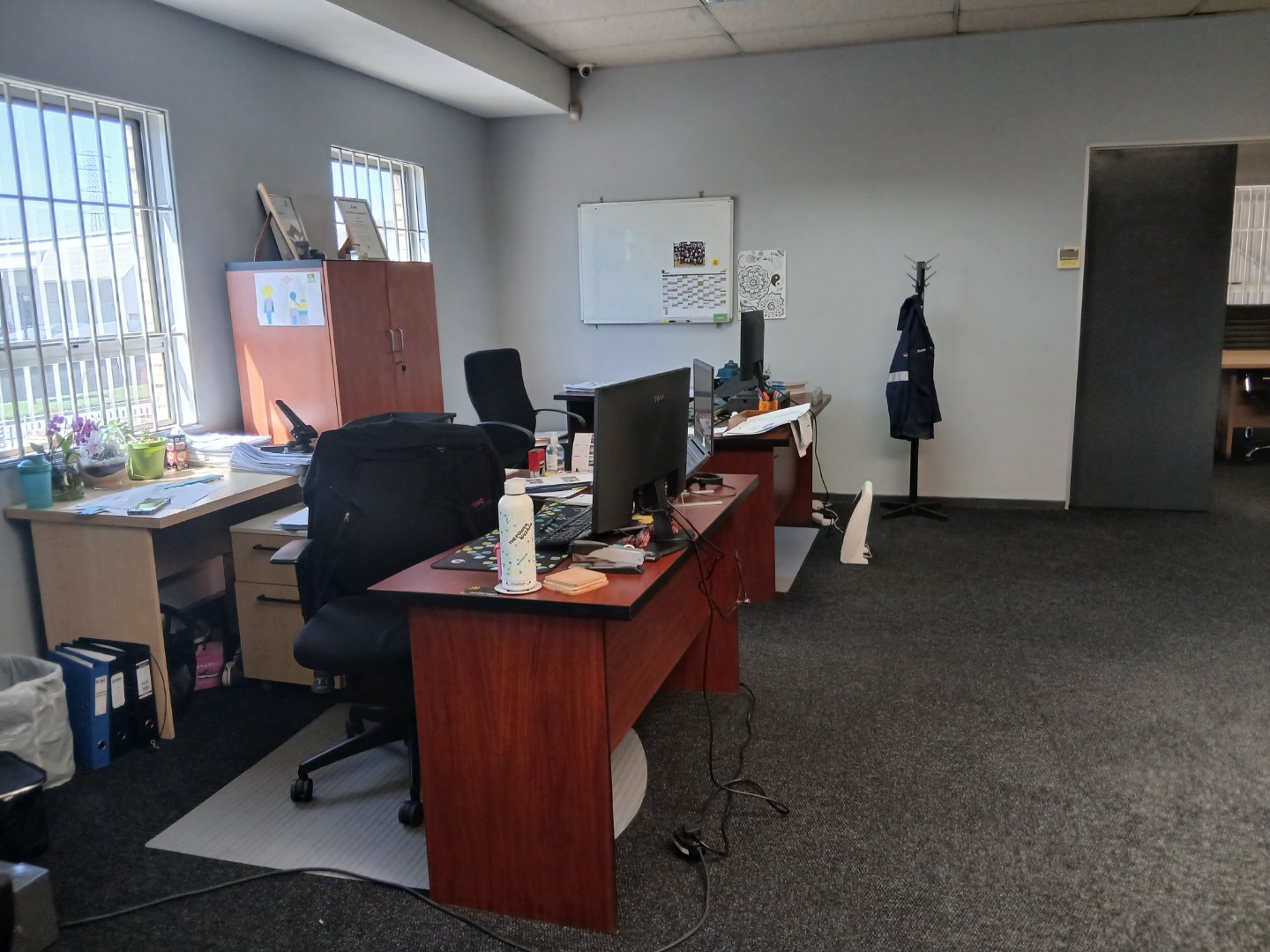 Modern office workspace with desks, chairs, computers, and office supplies in Meadowdale.